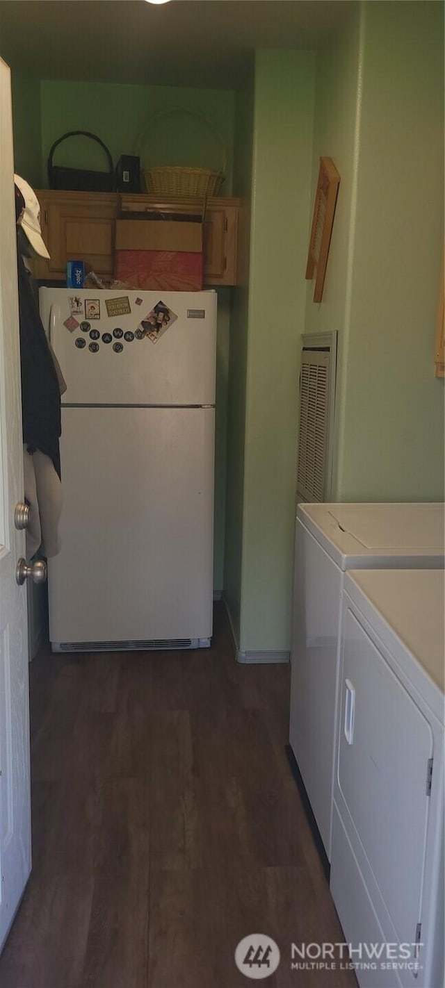 19425 Grant Rd NW, Soap Lake, WA 98851 - laundry room with washer and dryer, dark wood finished floors, and cabinet space