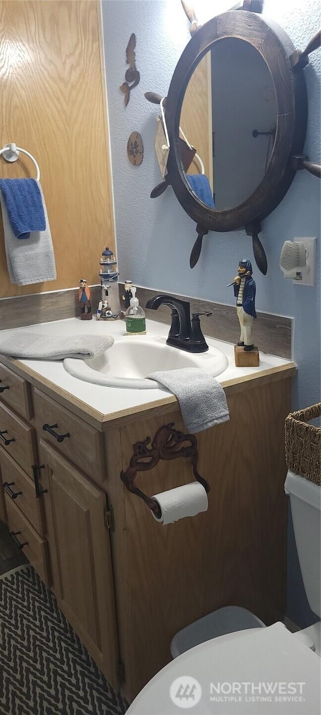 19425 Grant Rd NW, Soap Lake, WA 98851 - half bathroom featuring toilet and vanity