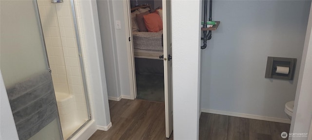 19425 Grant Rd NW, Soap Lake, WA 98851 - bathroom featuring a shower stall, wood finished floors, toilet, and baseboards