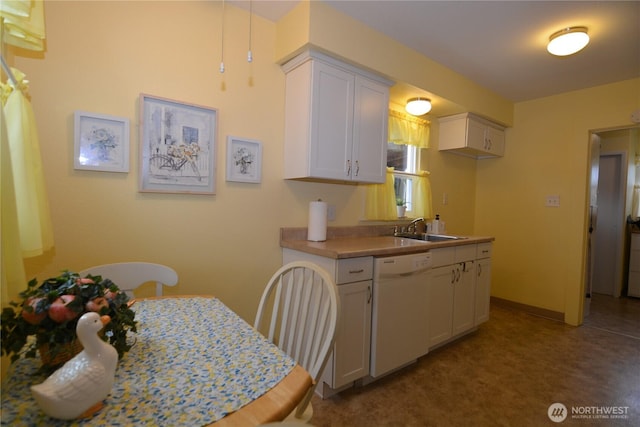 1605 7th Ave, Longview, WA 98632 - kitchen featuring dishwasher, a sink, white cabinetry, and baseboards