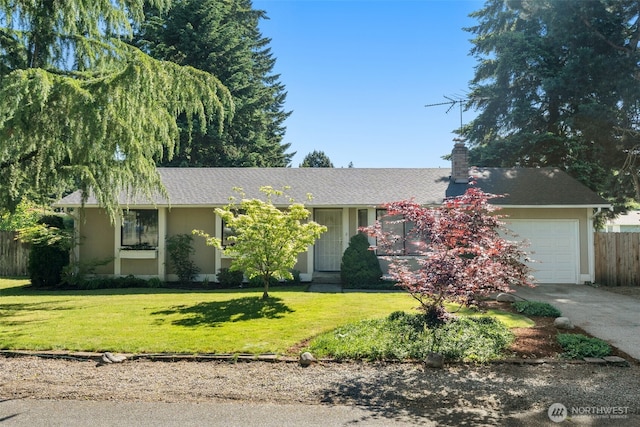 17001 5th Ave E, Spanaway, WA 98387 - view of front of property with a garage, a chimney, driveway, and stucco siding