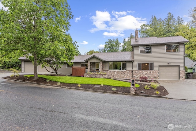 58 Pacific Pl, Longview, WA 98632 - view of front facade featuring driveway, a chimney, a front lawn, and a garage