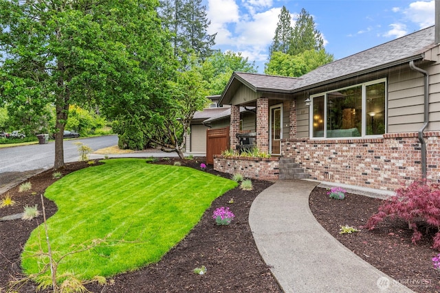 58 Pacific Pl, Longview, WA 98632 - view of front of home with brick siding, a front lawn, and a shingled roof