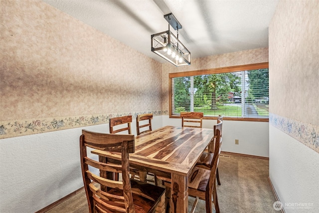 58 Pacific Pl, Longview, WA 98632 - carpeted dining space with wallpapered walls, baseboards, and a textured wall