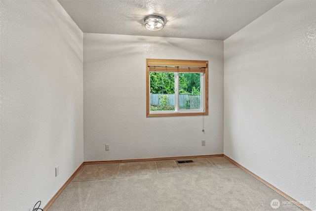 58 Pacific Pl, Longview, WA 98632 - empty room featuring carpet, baseboards, a textured ceiling, and a textured wall