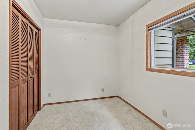 58 Pacific Pl, Longview, WA 98632 - unfurnished bedroom featuring carpet floors, a closet, and baseboards
