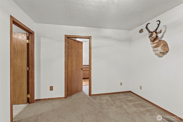 58 Pacific Pl, Longview, WA 98632 - carpeted spare room featuring a textured ceiling and baseboards