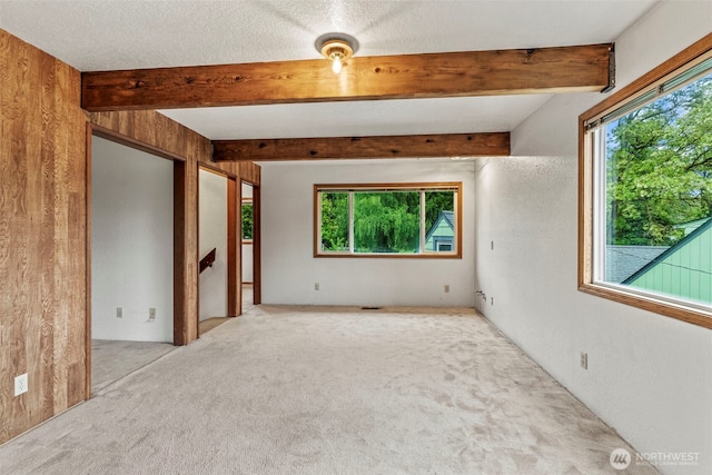 58 Pacific Pl, Longview, WA 98632 - carpeted empty room with beam ceiling