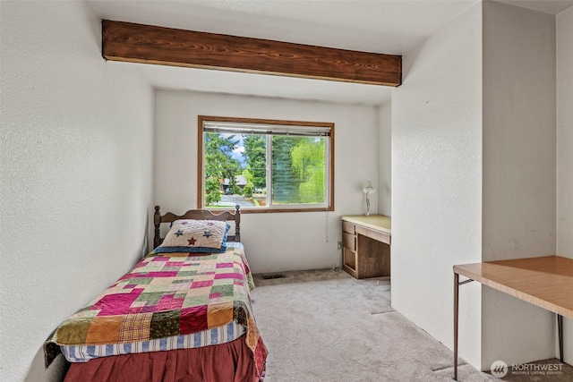 58 Pacific Pl, Longview, WA 98632 - bedroom with carpet flooring, beam ceiling, and a textured wall