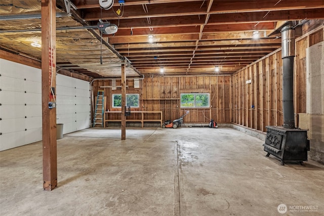 58 Pacific Pl, Longview, WA 98632 - garage featuring a wood stove and a garage door opener