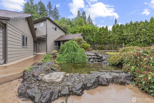 58 Pacific Pl, Longview, WA 98632 - view of yard with a small pond and a wooden deck