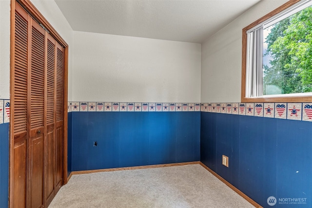 58 Pacific Pl, Longview, WA 98632 - unfurnished bedroom with carpet flooring, a closet, and wainscoting