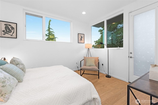 3427 22nd Ave W Unit A, Seattle, WA 98199 - bedroom featuring wood finished floors, recessed lighting, and baseboards