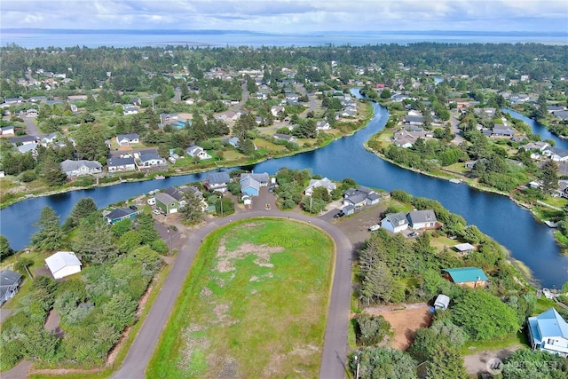 335 N Wynoochee Dr SW, Ocean Shores, WA 98569 - aerial view of property and surrounding area featuring a large body of water and nearby suburban area