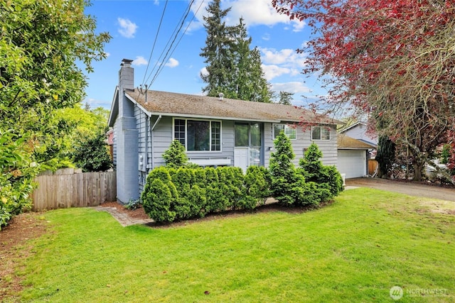 view of front of property featuring a chimney and a detached garage