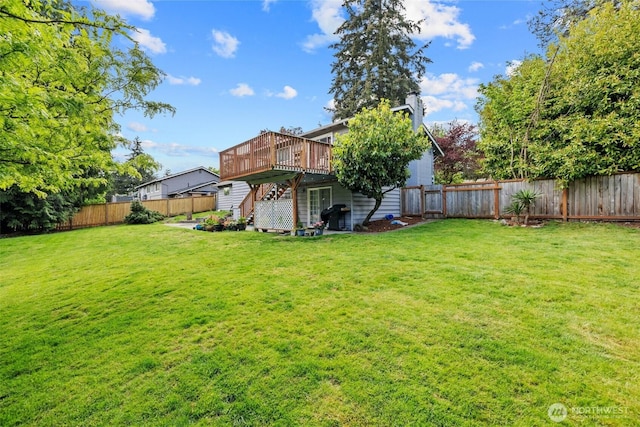view of yard with a wooden deck and stairs