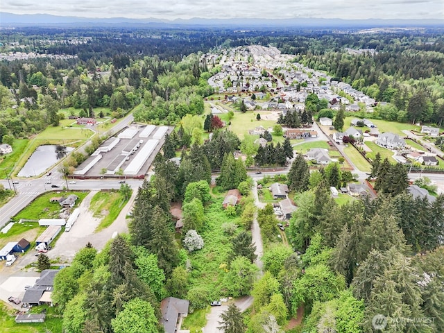 6811 128th St E, Puyallup, WA 98373 - aerial view of property's location featuring a heavily wooded area and nearby suburban area