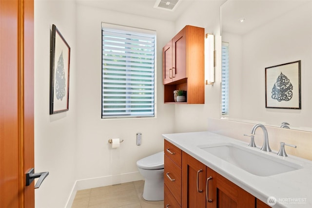 9120 NE 25th Pl, Clyde Hill, WA 98004 - bathroom with baseboards, toilet, tile patterned flooring, and vanity