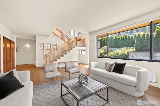 9120 NE 25th Pl, Clyde Hill, WA 98004 - living area featuring stairway, wood finished floors, and recessed lighting