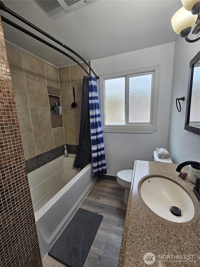 10915 Davisson Rd SW, Lakewood, WA 98499 - full bath featuring toilet, shower / bath combo with shower curtain, wood finished floors, and vanity