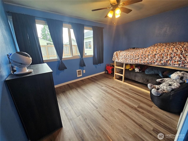 10915 Davisson Rd SW, Lakewood, WA 98499 - bedroom with wood finished floors, baseboards, and a ceiling fan