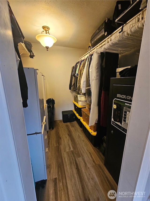 10915 Davisson Rd SW, Lakewood, WA 98499 - walk in closet featuring wood finished floors