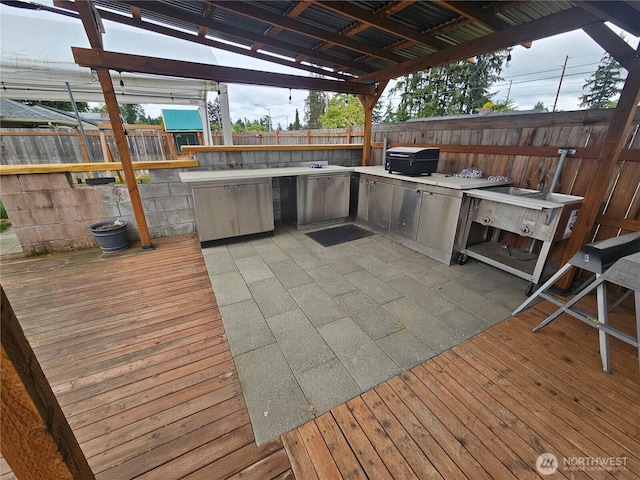 10915 Davisson Rd SW, Lakewood, WA 98499 - wooden terrace featuring area for grilling and a fenced backyard