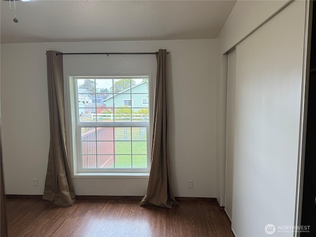 1710 263rd St, Ocean Park, WA 98640 - empty room featuring plenty of natural light, wood finished floors, and baseboards