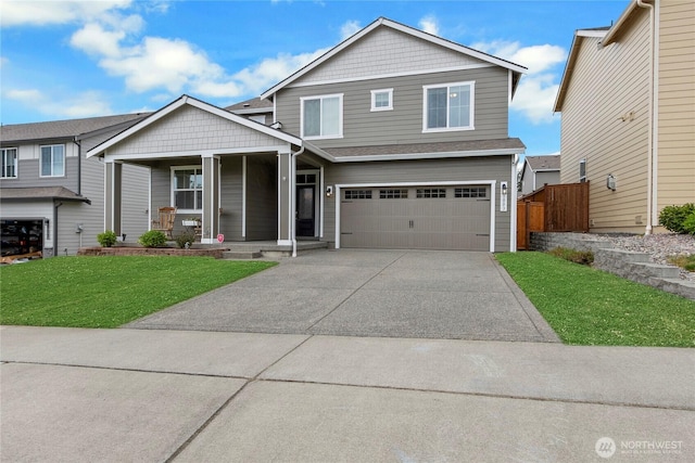 1003 Petersen Dr E, Enumclaw, WA 98022 - view of front of property featuring a porch, an attached garage, and concrete driveway