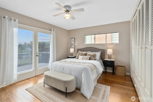 2922 5th Ave W, Seattle, WA 98119 - bedroom featuring french doors, light wood finished floors, access to outside, and a ceiling fan