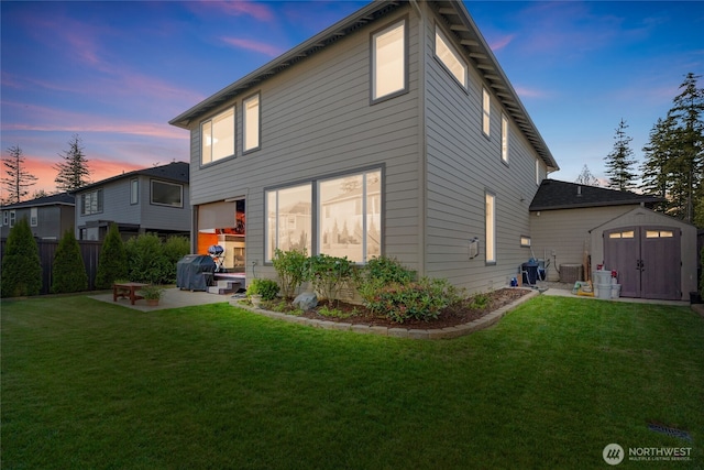 2553 Vardon Cir SW, Port Orchard, WA 98367 - rear view of house with a storage shed, a patio, an outdoor structure, and a yard
