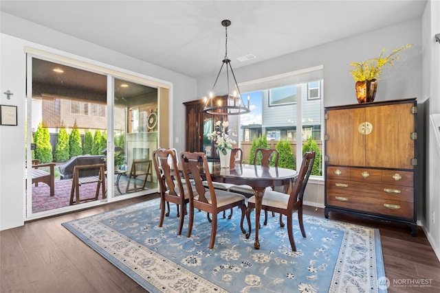 2553 Vardon Cir SW, Port Orchard, WA 98367 - dining space featuring a chandelier, plenty of natural light, dark wood-type flooring, and baseboards