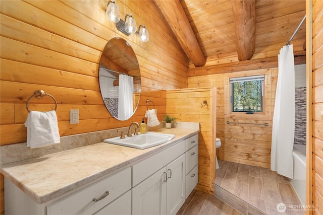 1831 Cottontail Ln, Chelan, WA 98816 - full bath with toilet, vanity, wood finished floors, wood ceiling with exposed beams, and shower / tub combo with curtain