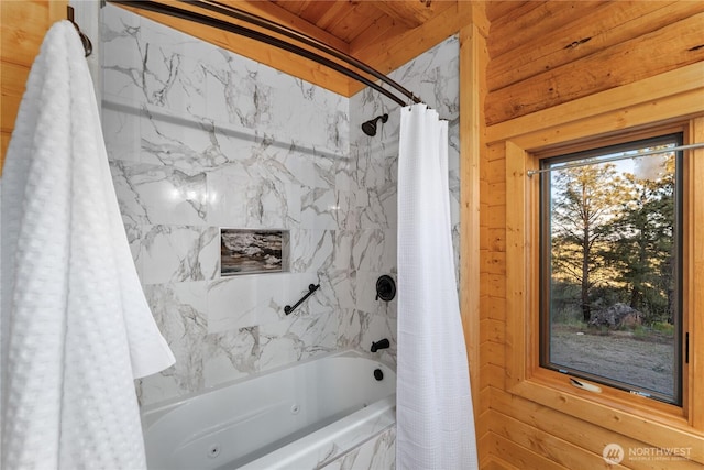 1831 Cottontail Ln, Chelan, WA 98816 - bathroom featuring shower / bathtub combination with curtain and wood walls