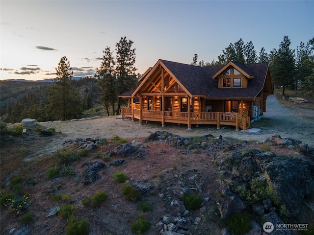 1831 Cottontail Ln, Chelan, WA 98816 - rear view of house featuring a porch and log exterior