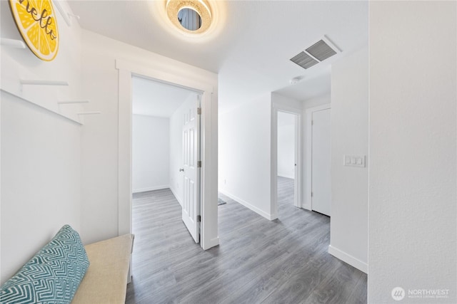 15396 Dewey Crest Ln, Anacortes, WA 98221 - hallway featuring wood finished floors and baseboards