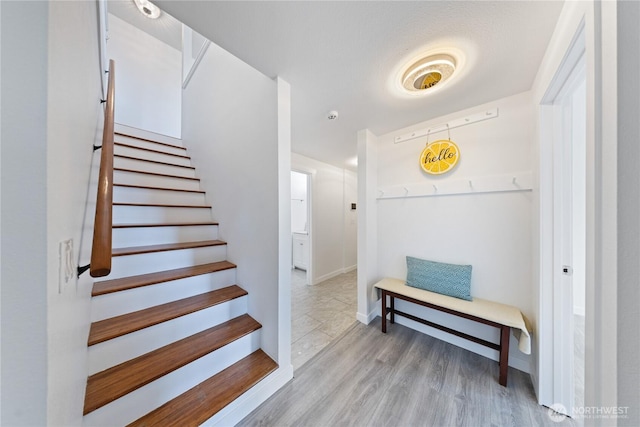 15396 Dewey Crest Ln, Anacortes, WA 98221 - stairway featuring wood finished floors and baseboards