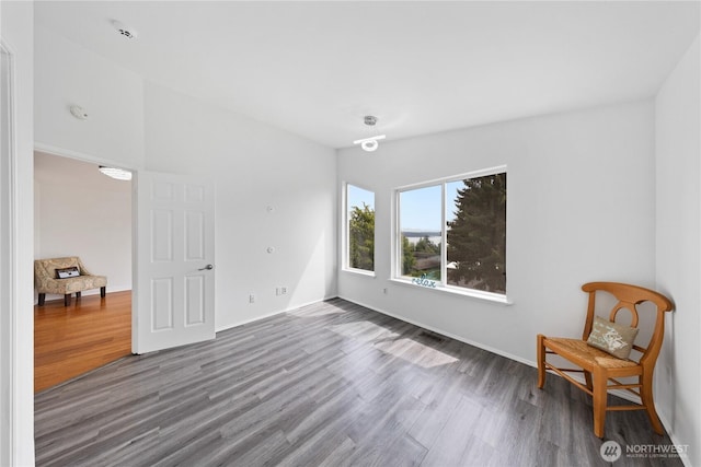 15396 Dewey Crest Ln, Anacortes, WA 98221 - unfurnished room with wood finished floors, a smoke detector, and baseboards
