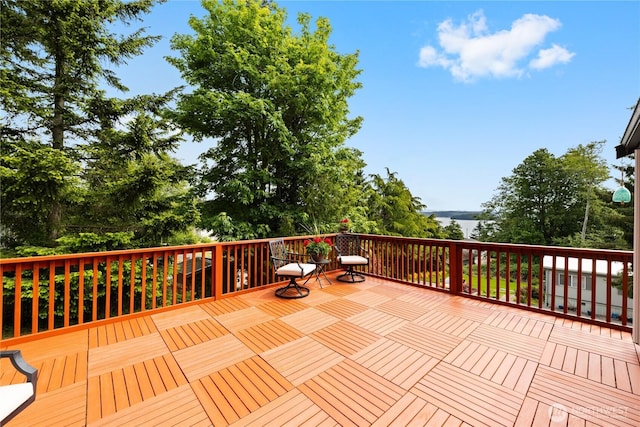 15396 Dewey Crest Ln, Anacortes, WA 98221 - wooden terrace featuring view of scattered trees