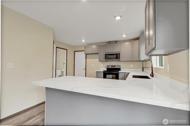 20116 58th Ave E, Spanaway, WA 98387 - kitchen featuring black electric range oven, a sink, gray cabinetry, stainless steel microwave, and light stone counters
