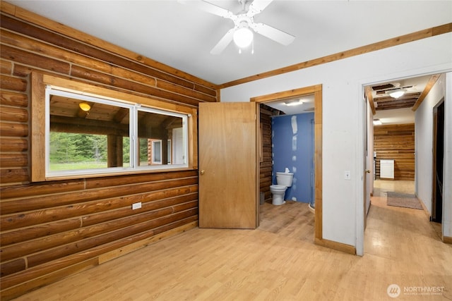 4193 Sparks Rd, Easton, WA 98925 - unfurnished bedroom with log walls, light wood-style floors, and connected bathroom