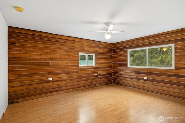 4193 Sparks Rd, Easton, WA 98925 - unfurnished room featuring ceiling fan, wood finished floors, log walls, and a smoke detector