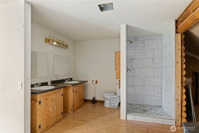 4193 Sparks Rd, Easton, WA 98925 - full bathroom featuring toilet, a shower stall, wood finished floors, and vanity