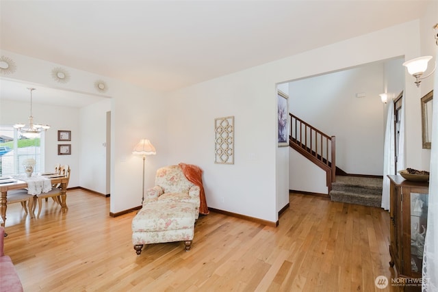3323 Appaloosa Way, Bremerton, WA 98310 - living area featuring a chandelier, light wood-type flooring, stairway, and baseboards