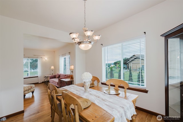 3323 Appaloosa Way, Bremerton, WA 98310 - dining space with light wood-style floors, a chandelier, and baseboards