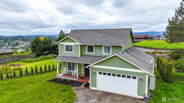 3323 Appaloosa Way, Bremerton, WA 98310 - traditional-style house featuring a porch, driveway, an attached garage, and a shingled roof
