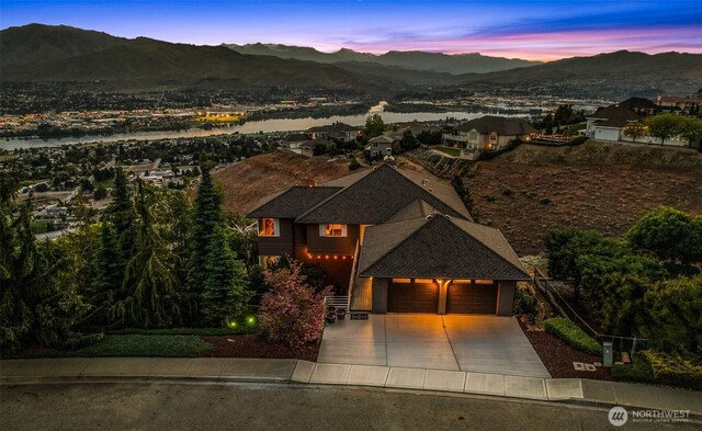 2336 Grand Ave, East Wenatchee, WA 98802 - view of front of house featuring a mountain view, driveway, and an attached garage