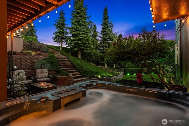 2336 Grand Ave, East Wenatchee, WA 98802 - patio terrace at dusk with a fire pit, a patio area, and stairs