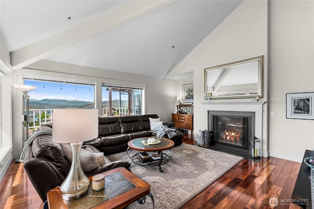 2336 Grand Ave, East Wenatchee, WA 98802 - living area with wood finished floors, a fireplace with flush hearth, baseboards, high vaulted ceiling, and beam ceiling