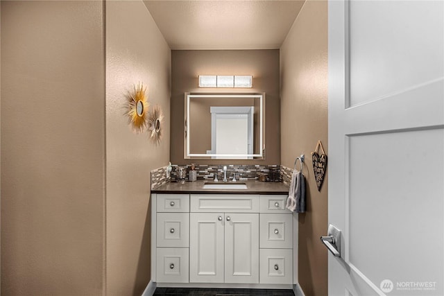 2336 Grand Ave, East Wenatchee, WA 98802 - bathroom with vanity, tasteful backsplash, baseboards, and a textured wall
